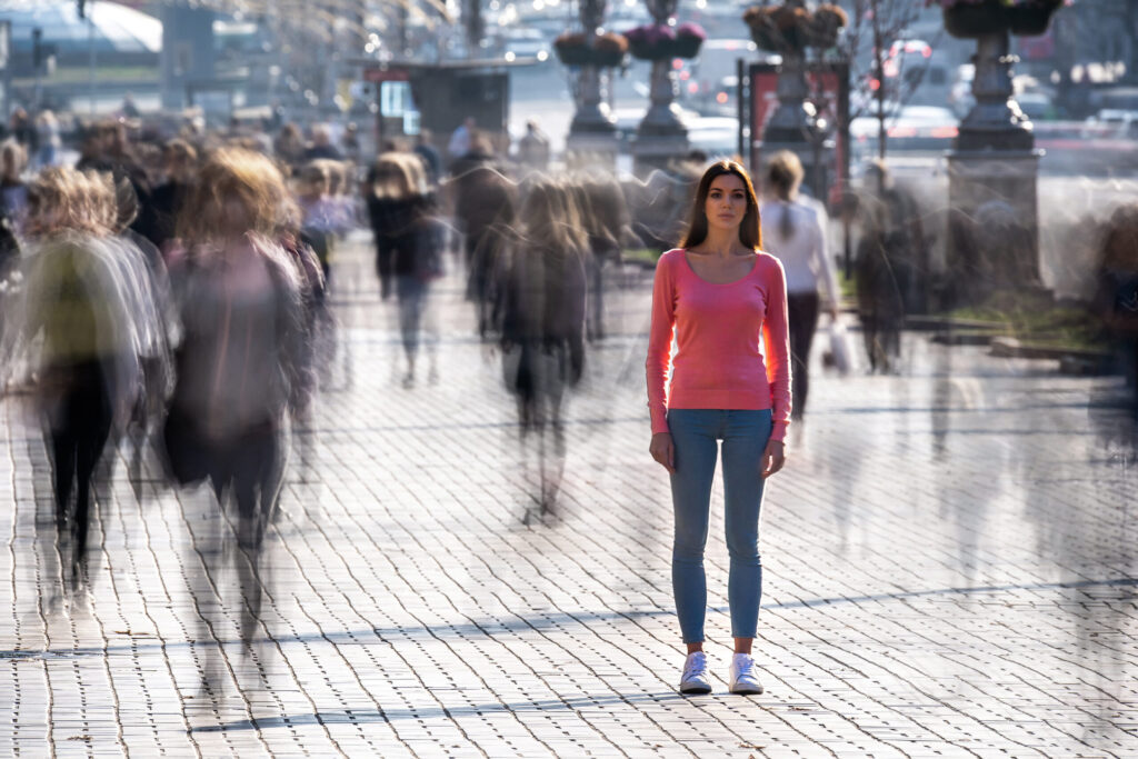 Understanding Schizophrenia: woman alone in crowd